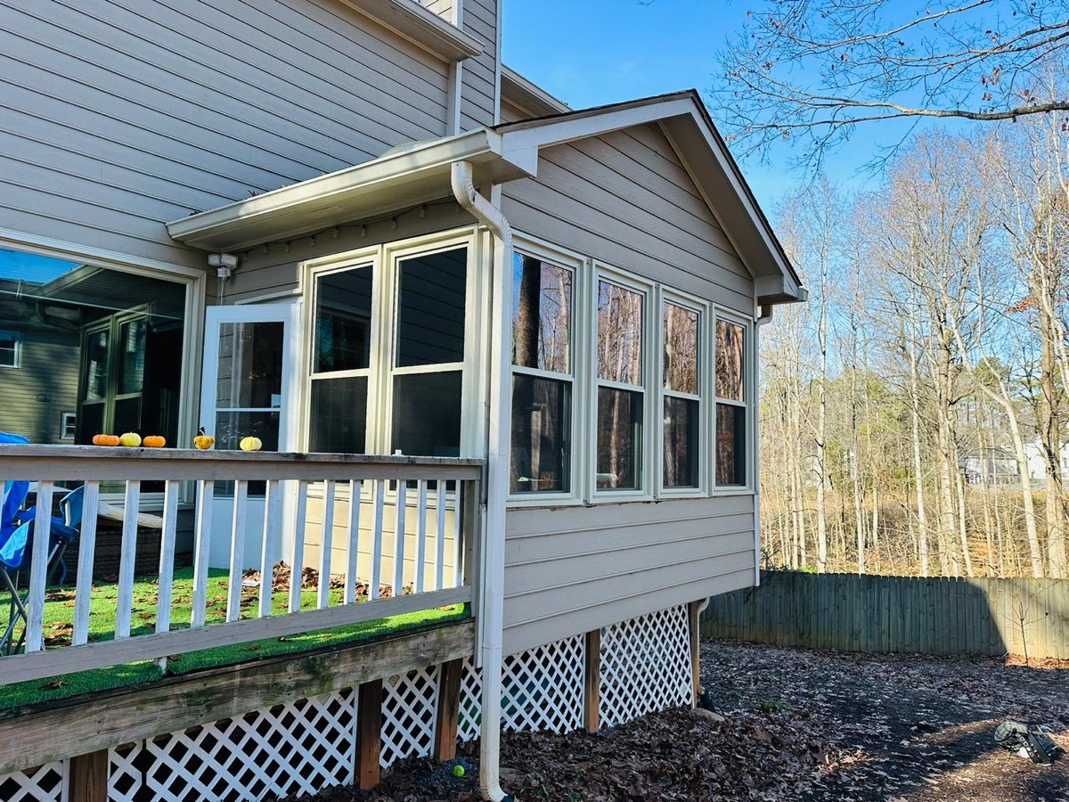 Sunroom addition wrapped in new double-hung windows — Suwanee, GA